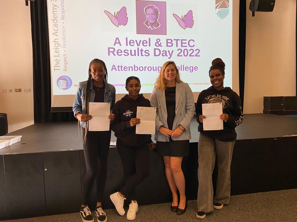 The Leigh Academy's Principal, Julia Collins, seen stood alongside three Post-16 students as they open their results on A Level Results Day 2022.