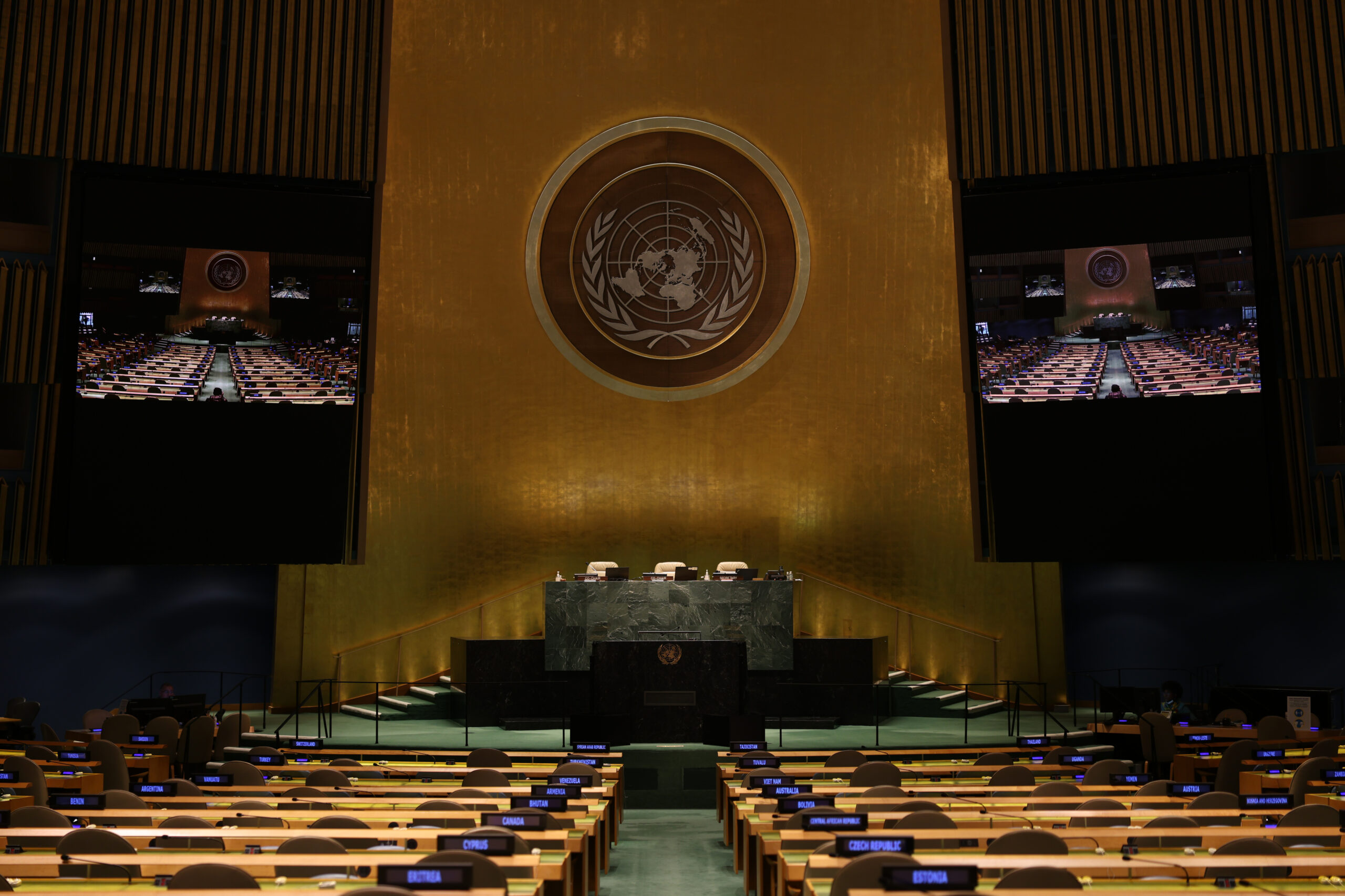 United Nations General Assembly chamber, front view of the podium with a UN emblem