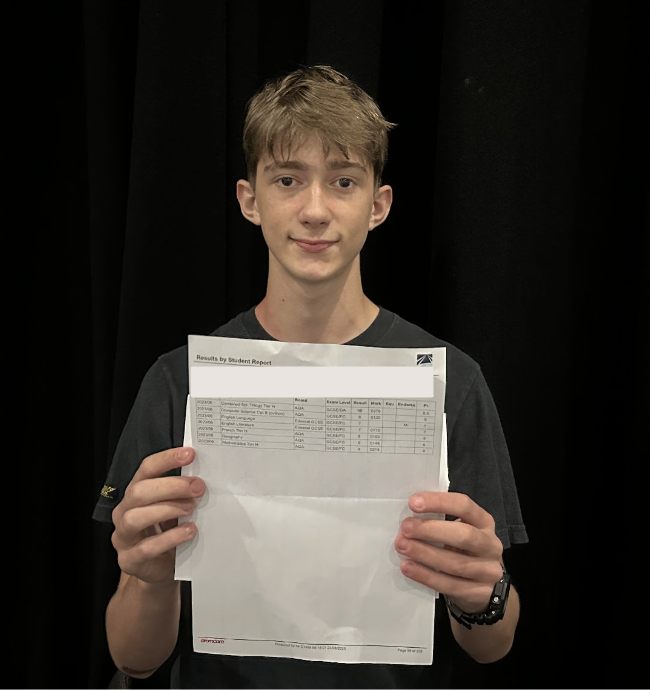 Student holding their results